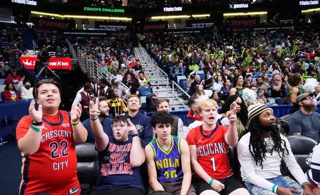 Young New Orleans Pelicans fans react in the second half of an NBA basketball game against the Memphis Grizzlies, Friday, Jan. 30, 2026, in New Orleans. (AP Photo/Gerald Herbert)