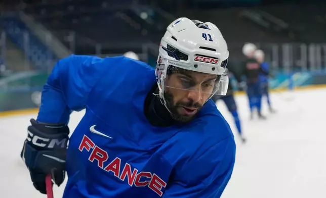 France's Pierre-Edouard Bellemare skate on the ice during a training session prior to the 2026 Winter Olympics, in Milan, Italy, Wednesday, Feb. 4, 2026. (AP Photo/Hassan Ammar)