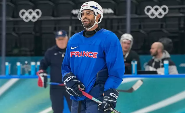 France's Pierre-Edouard Bellemare skate on the ice during a training session prior to the 2026 Winter Olympics, in Milan, Italy, Wednesday, Feb. 4, 2026. (AP Photo/Hassan Ammar)