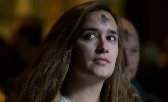 Parishioners depart following an Ash Wednesday Mass at the Cathedral of St. Matthew the Apostle, Wednesday, Feb., 18, 2026, in Washington. (AP Photo/Rod Lamkey, Jr.)