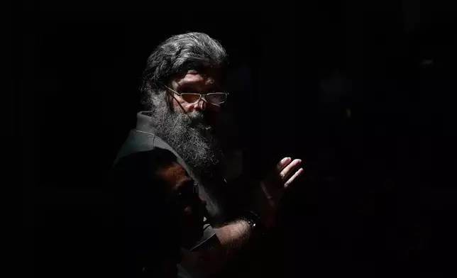 A parishioner prays after receiving ashes on Ash Wednesday in Mexico City, Wednesday, Feb. 18, 2026. (AP Photo/Marco Ugarte)