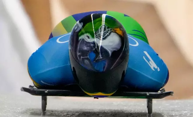 FILE - Nicole Silveira, of Brazil, slides during women's skeleton run 1 at the 2022 Winter Olympics, Feb. 11, 2022, in the Yanqing district of Beijing. (AP Photo/Dmitri Lovetsky, File)