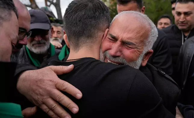 The father of policeman Hassan Jaber, 38, who was killed with his son Ali, 4, on Monday by an Israeli drone attack, mourns during their funeral procession in Yanouh village, south Lebanon, Tuesday, Feb. 10, 2026. (AP Photo/Mohammed Zaatari)