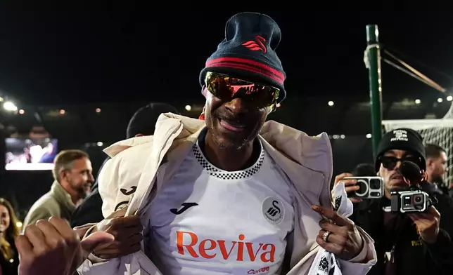 Swansea City co-owner Snoop Dogg ahead of the English Championship soccer match between Swansea City and Preston in Swansea, Wales, Tuesday, Feb. 24, 2026. (Jacob King/PA via AP)
