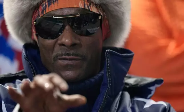 Snoop Dogg watches the men's 1,000 meters speedskating race at the 2026 Winter Olympics, in Milan, Italy, Wednesday, Feb. 11, 2026. (AP Photo/Ben Curtis)