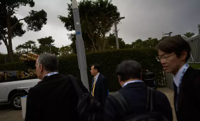 Visitors attend a defense industry exhibition in Tel Aviv, Israel, Tuesday, Feb. 17, 2026. (AP Photo/Oded Balilty)