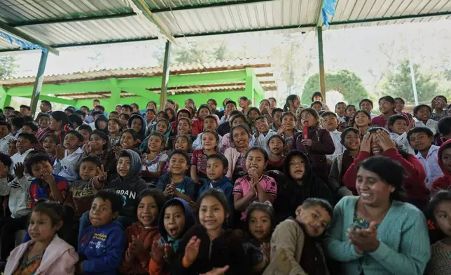 Students attend a presentation of books printed in a Mayan language at a school in San Jose Poaquil, Guatemala, Thursday, Guatemala, Feb. 19, 2026, ahead of International Mother Language Day. (AP Photo/Emmanuel Andres)