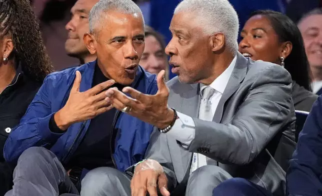 Barack Obama talks to Julius Erving during the NBA All-Star basketball game Sunday, Feb. 15, 2026, in Inglewood, Calif. (AP Photo/Mark J. Terrill)