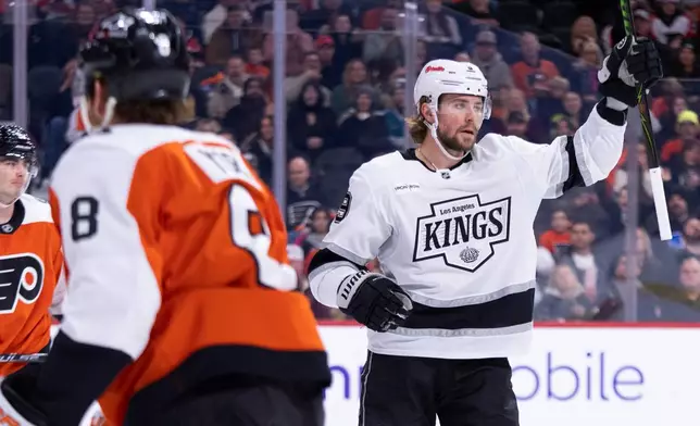 Los Angeles Kings' Adrian Kempe, right, reacts to his goal during the first period of an NHL hockey game against the Philadelphia Flyers, Saturday, Jan. 31, 2026, in Philadelphia. (AP Photo/Chris Szagola)