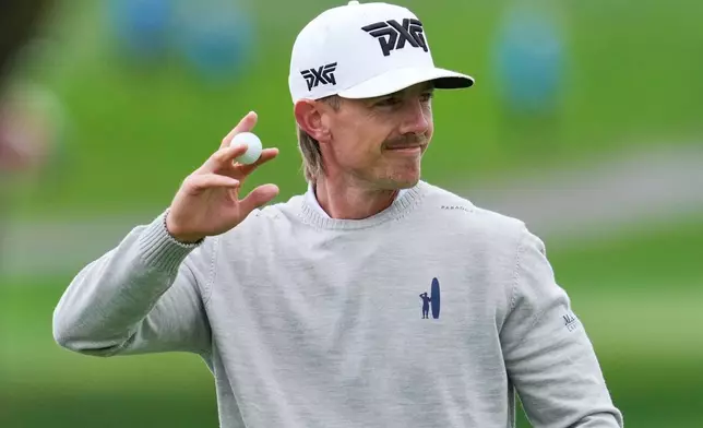 Jake Knapp waves to the gallery after making a putt on the second green at Pebble Beach Golf Links during the third round of the AT&amp;T Pebble Beach Pro-Am golf tournament, Saturday, Feb. 14, 2026, in Pebble Beach, Calif. (AP Photo/Godofredo A. Vásquez)