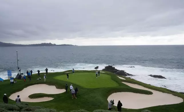 Rickie Fowler putts on the seventh hole at Pebble Beach Golf Links during the third round of the AT&amp;T Pebble Beach Pro-Am golf tournament, Saturday, Feb. 14, 2026, in Pebble Beach, Calif. (AP Photo/Godofredo A. Vásquez)