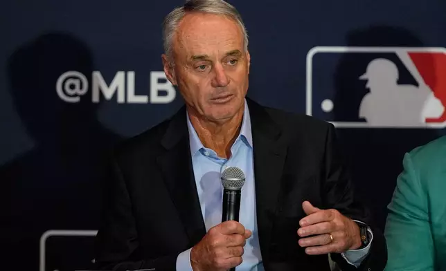 FILE - Rob Manfred, commissioner of Major League Baseball, answers questions during a news conference at the MLB winter meetings, Dec. 8, 2025, in Orlando, Fla. (AP Photo/John Raoux, File)