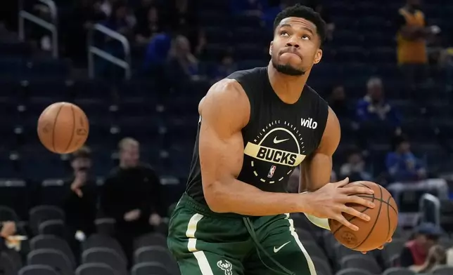 FILE - Milwaukee Bucks forward Giannis Antetokounmpo warms up before an NBA basketball game against the Golden State Warriors in San Francisco, Jan. 7, 2026. (AP Photo/Jeff Chiu, File)