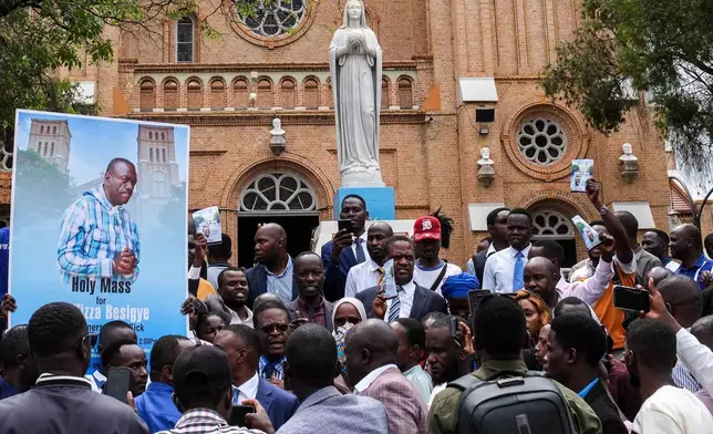 Supporters of detained Ugandan opposition figure Kizza Besigye gather for a prayer to press authorities to free him at Rubaga Cathedral in Kampala, Monday, Feb. 23, 2026. (AP Photo/Hajarah Nalwadda)