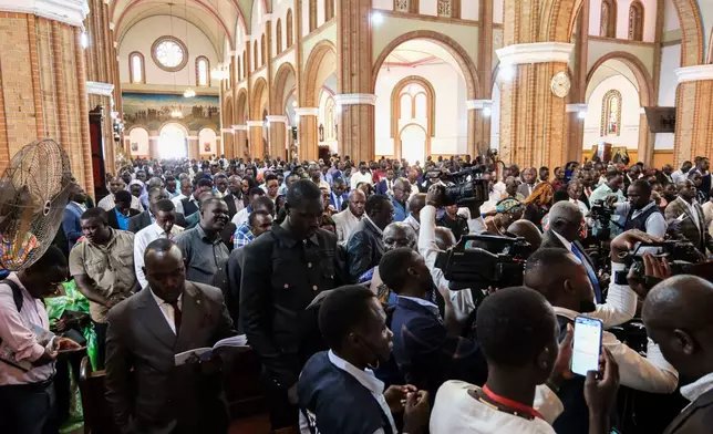 Supporters of detained Ugandan opposition figure Kizza Besigye gather for a prayer to press authorities to free him at Rubaga Cathedral in Kampala, Monday, Feb. 23, 2026. (AP Photo/Hajarah Nalwadda)