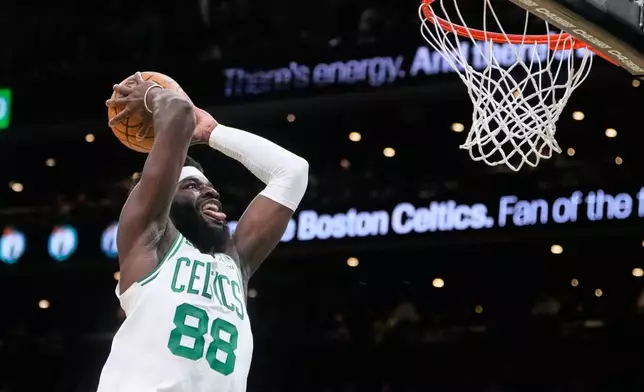 Boston Celtics center Neemias Queta (88) lines up a dunk against the Brooklyn Nets during the first half of an NBA basketball game, Friday, Feb. 27, 2026, in Boston. (AP Photo/Charles Krupa)