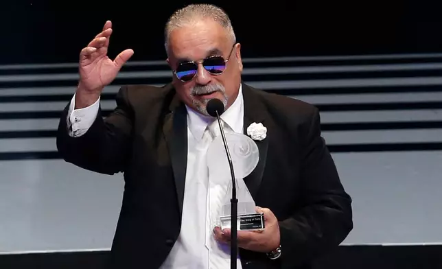 FILE - Willie Colon accepts the award for best musica afroamericana at the Lunas del Auditorio Nacional awards ceremony in Mexico City, Oct. 31, 2018. Colón, considered by many to be the "architect of urban salsa," died Saturday, Feb. 21, 2026. He was 75. (AP Photo/Claudio Cruz, File)