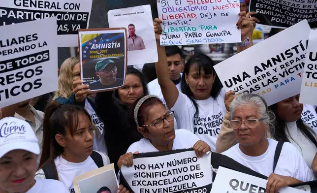 People who consider their detained family members to be political prisoners protest for their releases outside the National Assembly in Caracas, Venezuela, Tuesday, Feb. 10, 2026. (AP Photo/Ariana Cubillos)