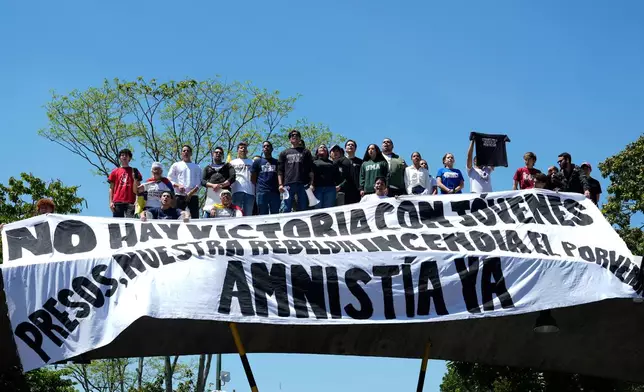 Students march on National Youth Day, calling for the release of people considered political prisoners, in Caracas, Venezuela, Thursday, Feb. 12, 2026. (AP Photo/Ariana Cubillos)