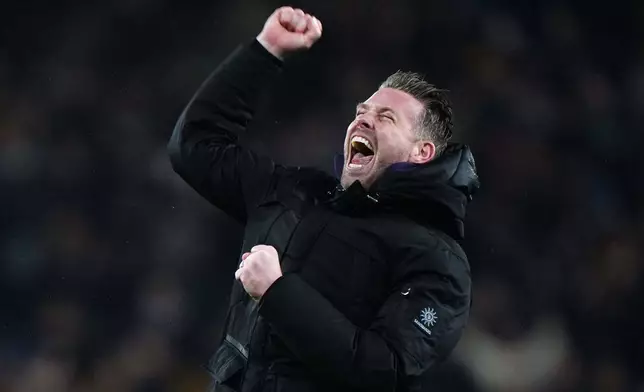 Wolverhampton Wanderers manager Rob Edwards celebrates their win after their English Premier League soccer match against Aston Villa in Wolverhampton, England, Friday, Feb. 27, 2026. (Bradley Collyer/PA via AP)