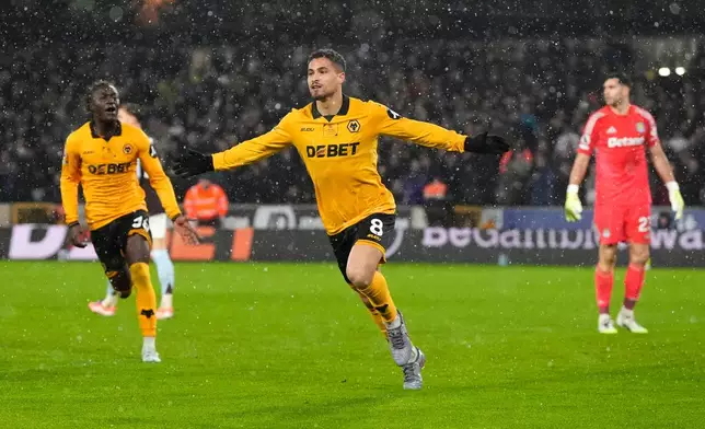 Wolverhampton Wanderers' Joao Gomes celebrates scoring their side's first goal of the game during their English Premier League soccer match against Aston Villa in Wolverhampton, England, Friday, Feb. 27, 2026. (Nick Potts/PA via AP)