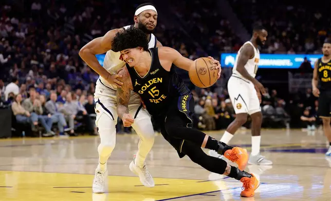 Golden State Warriors forward Gui Santos (15) drives in against Denver Nuggets forward/guard Bruce Brown, left, during the first half of an NBA basketball game, Sunday, Feb. 22, 2026, in San Francisco. (AP Photo/Kelley L Cox)