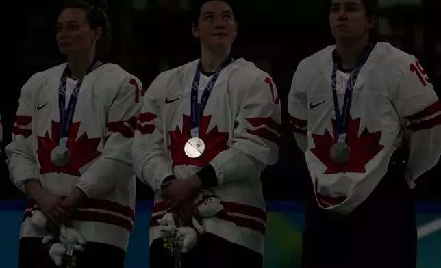 The silver medal on Canada's Ella Shelton reflects during medals ceremony at the 2026 Winter Olympics, in Milan, Italy, Thursday, Feb. 19, 2026. (AP Photo/Hassan Ammar)