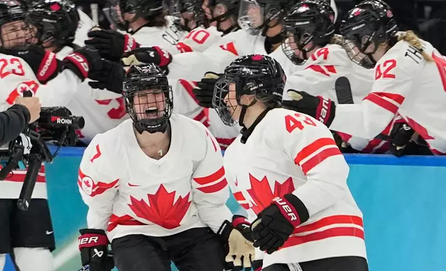 Canada's Kristin O'Neill (43) celebrates after scoring her side's opening goal during a women's ice hockey gold medal game between the United States and Canada at the 2026 Winter Olympics, in Milan, Italy, Thursday, Feb. 19, 2026. (AP Photo/Hassan Ammar)