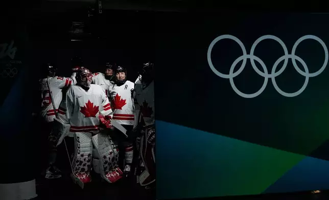 Canada's players arrive for the warm up ahead of a women's ice hockey gold medal game between the United States and Canada at the 2026 Winter Olympics, in Milan, Italy, Thursday, Feb. 19, 2026. (AP Photo/Petr David Josek)