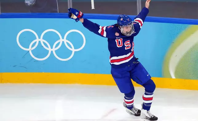 United States' Megan Keller celebrates after scoring the winning goal against Canada during the overtime period of the women's ice hockey gold medal game at the 2026 Winter Olympics, in Milan, Italy, Thursday, Feb. 19, 2026. (AP Photo/Carolyn Kaster)