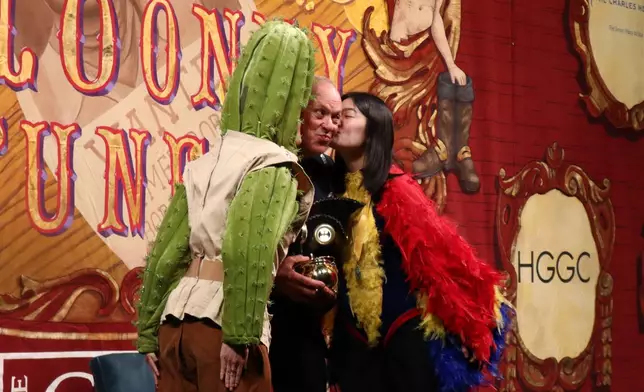Actor Michael Keaton receives his award during Harvard University's annual Hasty Pudding Theatricals Man of the Year award show at Farkas Hall , Friday, Feb. 6, 2026 in Cambridge, Mass. (AP Photo/Leah Willingham)