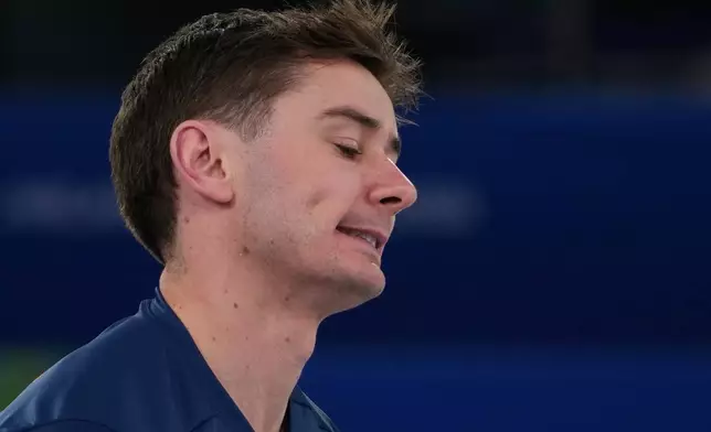 Britain's Grant Hardie reacts during a men's curling gold medal match between Britain and Canada, at the 2026 Winter Olympics, in Cortina d'Ampezzo, Italy, Saturday, Feb. 21, 2026. (AP Photo/Misper Apawu)