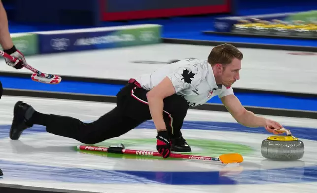 Canada's Marc Kennedy competes during a men's curling gold medal match between Britain and Canada, at the 2026 Winter Olympics, in Cortina d'Ampezzo, Italy, Saturday, Feb. 21, 2026. (AP Photo/Misper Apawu)