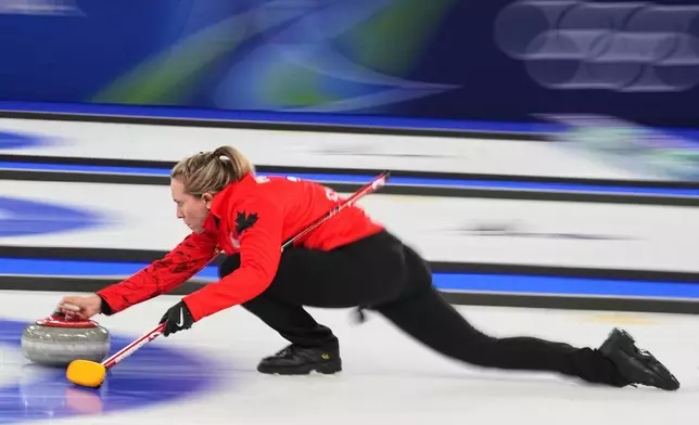 Canada's Rachel Homan competes during a women's curling bronze medal match between Canada and the United States, at the 2026 Winter Olympics, in Cortina d'Ampezzo, Italy, Saturday, Feb. 21, 2026. (AP Photo/Fatima Shbair)