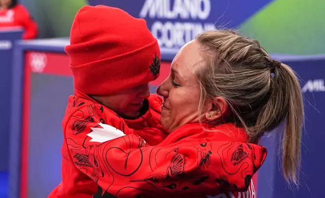 Canada's Rachel Homan celebrates winning the women's curling bronze medal match against the United States, at the 2026 Winter Olympics, in Cortina d'Ampezzo, Italy, Saturday, Feb. 21, 2026. (AP Photo/Fatima Shbair)