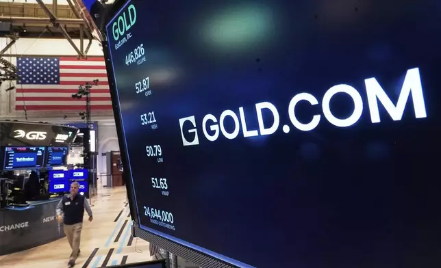 The logo for Gold.com is displayed above a trading post on the floor of the New York Stock Exchange, Tuesday, Feb. 3, 2026. (AP Photo/Richard Drew)
