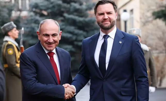 Armenia's Prime Minister Nikol Pashinyan shakes hands with Vice President JD Vance, at the President's Residence, in Yerevan, Armenia, Monday, Feb. 9, 2026. (Kevin Lamarque/Pool Photo via AP)