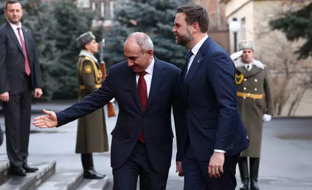 Armenia's Prime Minister Nikol Pashinyan, left, welcomes Vice President JD Vance, at the President's Residence, in Yerevan, Armenia, Monday, Feb. 9, 2026. (Kevin Lamarque/Pool Photo via AP)