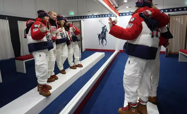 From left, United States' Tess Johnson, Jaelin Kauf, Olivia Giaccio and Elizabeth Lemley pose for photographers as they wear the Team USA uniforms designed by Ralph Lauren at the 2026 Winter Olympics, in Milan, Italy, Wednesday, Feb. 4, 2026. (AP Photo/Antonio Calanni)