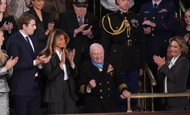 First lady Melania Trump applauds after presenting the Congressional Medal of Honor to World War II Navy Pilot Capt. Royce Williams during President Donald Trump's State of the Union address to a joint session of Congress in the House chamber at the U.S. Capitol in Washington, Tuesday, Feb. 24, 2026.(AP Photo/J. Scott Applewhite)