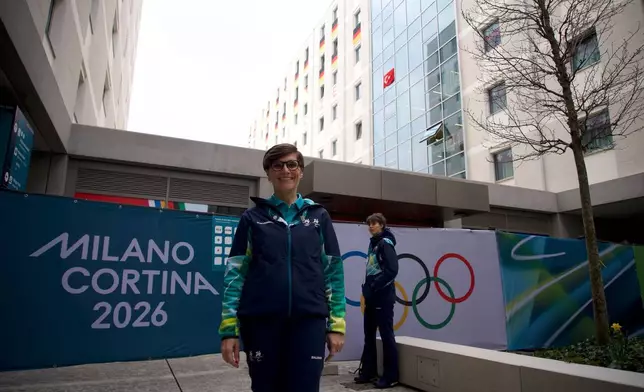 Olivia Azzalin, a volunteer poses for a photo at the Olympic Village, at the 2026 Winter Olympics, in Milan, Italy, Monday, Feb. 9, 2026. (AP Photo/Vasilisa Stepanenko)