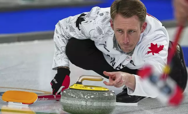Canada's Marc Kennedy in action during the men's curling round robin session against China, at the 2026 Winter Olympics, in Cortina d'Ampezzo, Italy, Sunday, Feb. 15, 2026. (AP Photo/Misper Apawu)