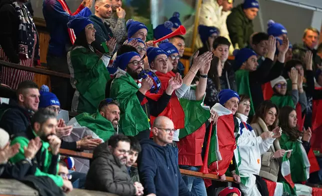 Italy fans watch the men's curling round robin session against Britain, at the 2026 Winter Olympics, in Cortina d'Ampezzo, Italy, Friday, Feb. 13, 2026. (AP Photo/Fatima Shbair)