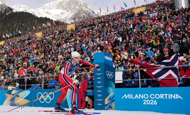 Silver medalist Vetle Sjaastad Christiansen, of Norway, crosses the finish line during the men's 10-kilometer sprint biathlon race at the 2026 Winter Olympics in Anterselva, Italy, Friday, Feb. 13, 2026. (AP Photo/David J. Phillip)