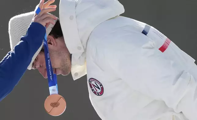 Sturla Holm Laegreid, of Norway, gets the bronze medal for the men's 10-kilometer sprint biathlon race at the 2026 Winter Olympics in Anterselva, Italy, Friday, Feb. 13, 2026. (AP Photo/Andrew Medichini)
