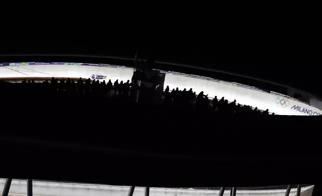 Czech Republic's Anna Fernstaedt slides down the track during a women's skeleton run at the 2026 Winter Olympics, in Cortina d'Ampezzo, Italy, Friday, Feb. 13, 2026. (AP Photo/Aijaz Rahi)