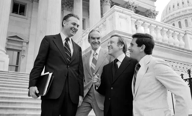FILE - Rep. Lee Hamilton, D-Ind., Rep. Jim Wright, D-Texas, Rep. John Brademas, D-Ind., and Stephen Solarz, D-N.Y., stand on the steps of the House of Representatives following a vote, Aug. 2, 1978, in Washington. (AP Photo/John Duricka, File)