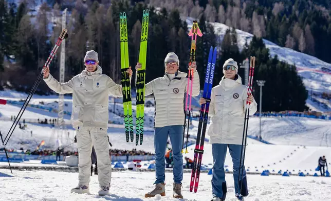 Silver medalist Mathis Desloges, of France, from left, gold medalist Johannes Hoesflot Klaebo, of Norway, and bronze medalist Einar Hedegart, of Norway, pose after the cross country skiing men's 10km interval start free at the 2026 Winter Olympics, in Tesero, Italy, Friday, Feb. 13, 2026. (AP Photo/Evgeniy Maloletka)