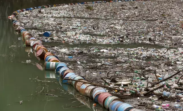 Waste floats on the Drina river in Visegrad, Bosnia, Thursday, Feb. 5, 2026. (AP Photo/Armin Durgut)