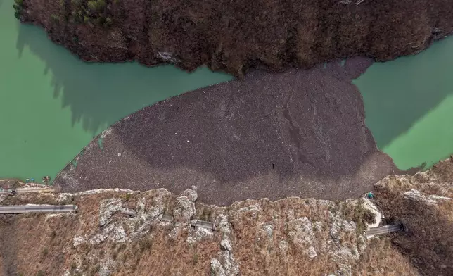 An aerial view shows tons of waste clogging the Drina river in Visegrad, Bosnia, Thursday, Feb. 5, 2026. (AP Photo/Armin Durgut)
